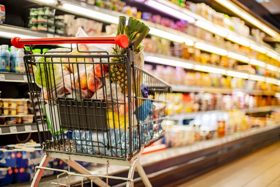 Shopping cart full of groceries.